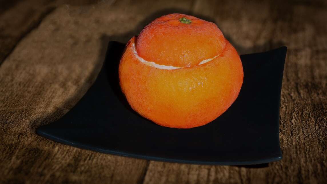 Parfait al mandarino in un mandarino